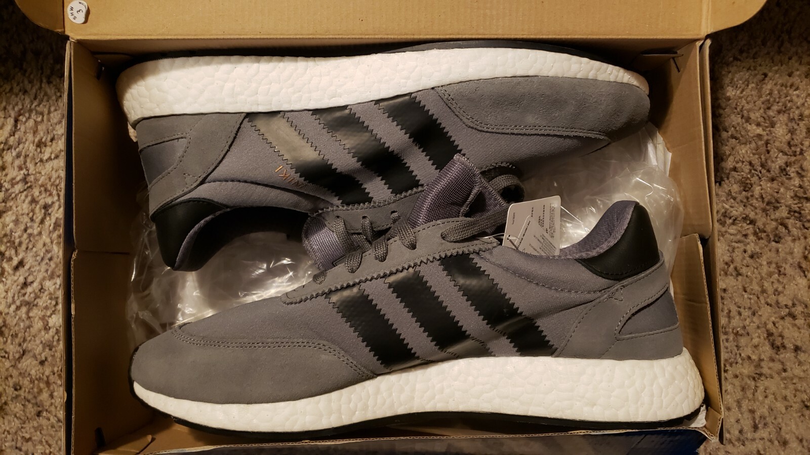 grey adidas iniki